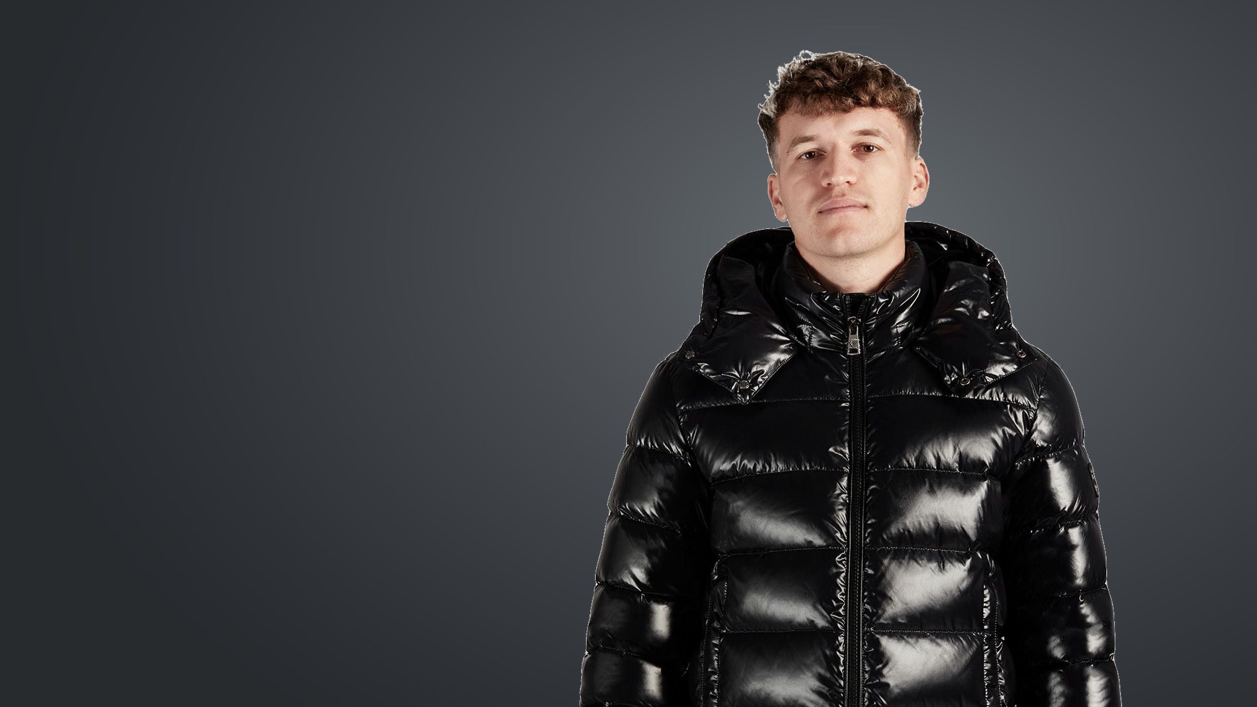 Man in a Nero glossy black down jacket